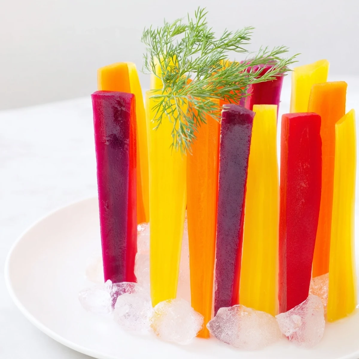 Fresh, crisp Simple Crudités: Rainbow carrot sticks shimmering in tall glasses, ready to serve.