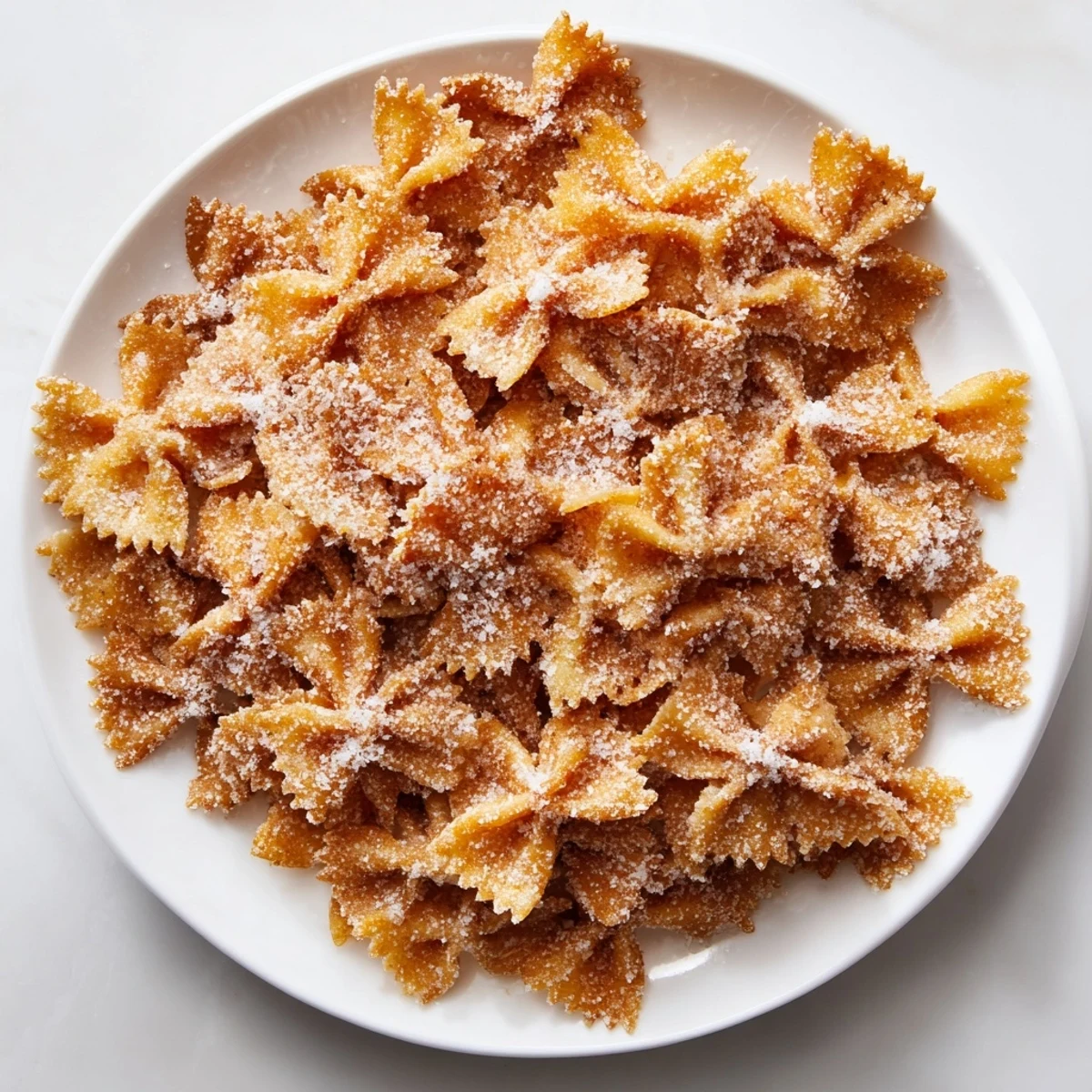Golden-brown Air Fryer Pasta Christmas Crack, a sweet and salty holiday snack, ready to enjoy.