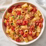 This baked goat cheese snowflake pasta showcases bubbling tomatoes and a creamy, delicious sauce.
