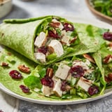 A close-up of a delicious Cranberry Pecan Chicken Salad Christmas Wrap, ready to eat.