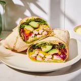 Close-up of sheet-pan fajita chicken, with a rainbow of peppers perfect for building delicious wraps.