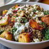 Golden roasted carrots, parsnips, and sweet potatoes fill this Hearty Winter Grain Bowl topped with seeds.