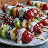 Bright Rainbow Fruit Skewers with Honey Dip, ready for a healthy, sweet treat.