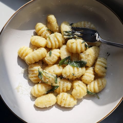 Steaming hot Homemade Potato Gnocchi, ready to be tossed with a rich, flavorful sauce.