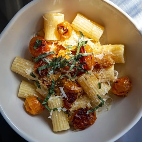 Baked goat cheese pasta garnished with fresh basil; a beautiful Italian-inspired main dish.