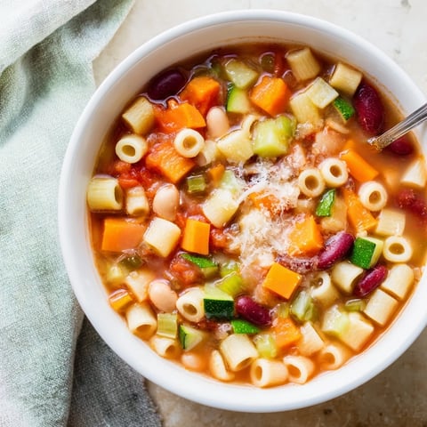 Hearty Veggie-Packed Minestrone Christmas Pasta Pot simmering in a pot, ready with tender pasta and veggies.
