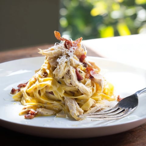 Fork-tender shredded chicken and crispy bacon mingle in a creamy Chicken Carbonara, served over al dente spaghetti.