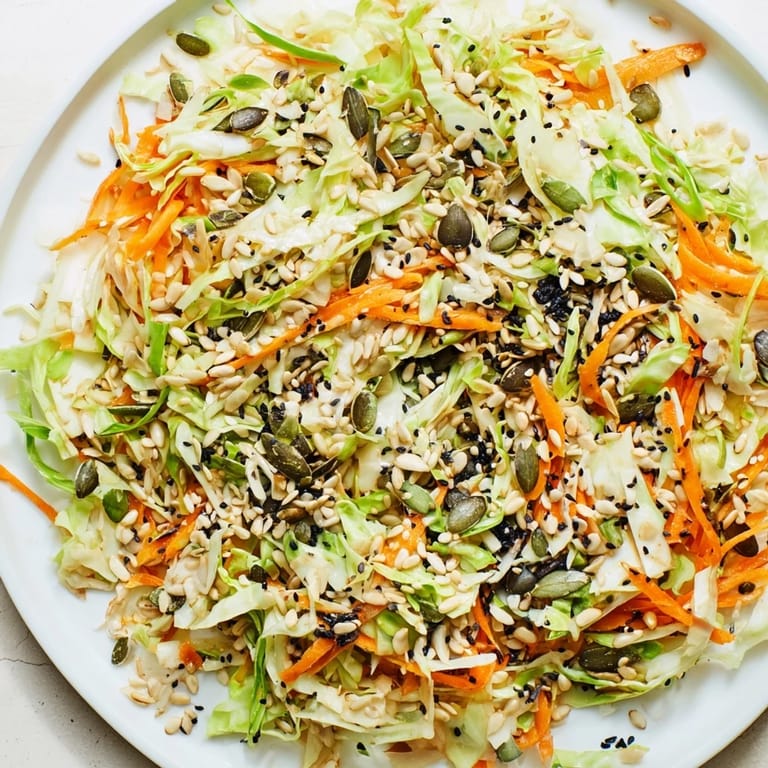 A bright bowl of this Cabbage-Core Slaw Salad, offering a delightful crunch and Asian-inspired flavors.