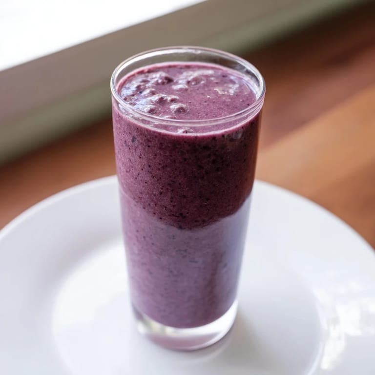 Refreshing Cherry Almond Smoothie with creamy texture, poured and ready to enjoy for breakfast or snack.