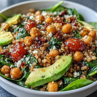 Vibrant Ancient Grains Bowl packed with farro, quinoa, chickpeas, and fresh veggies.